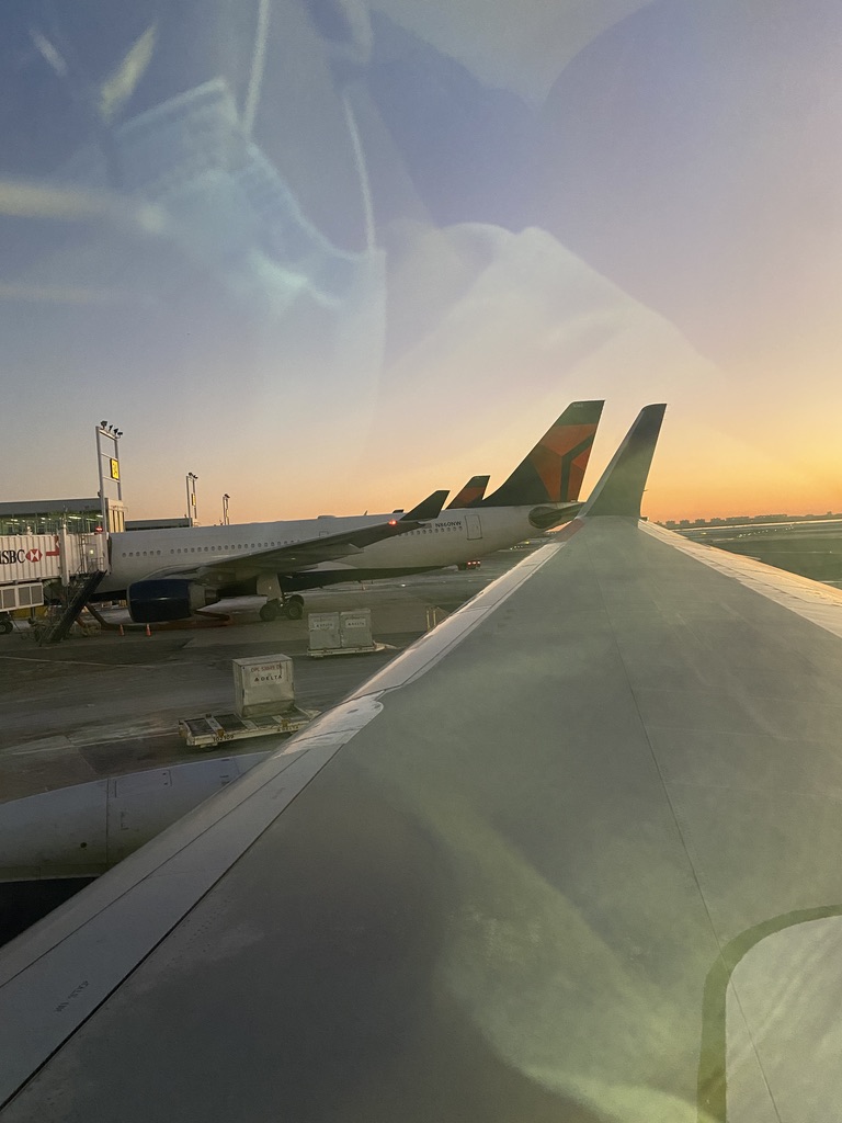 View of airplane wing out of plane window.