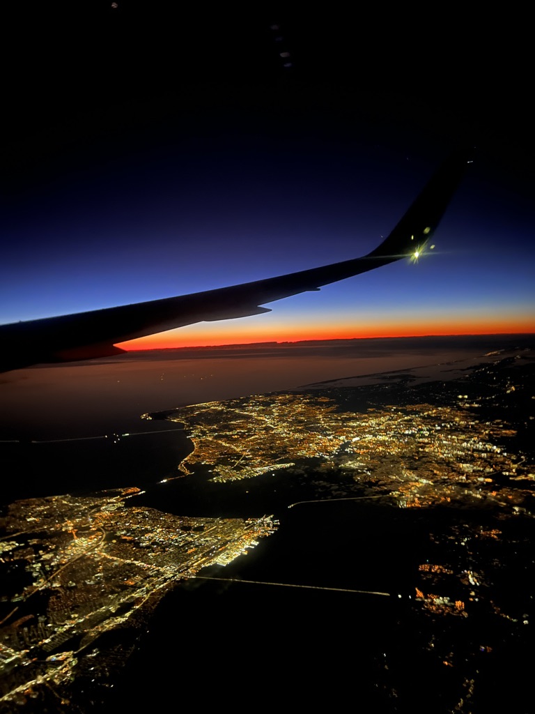 View of airplane wing out of plane window.