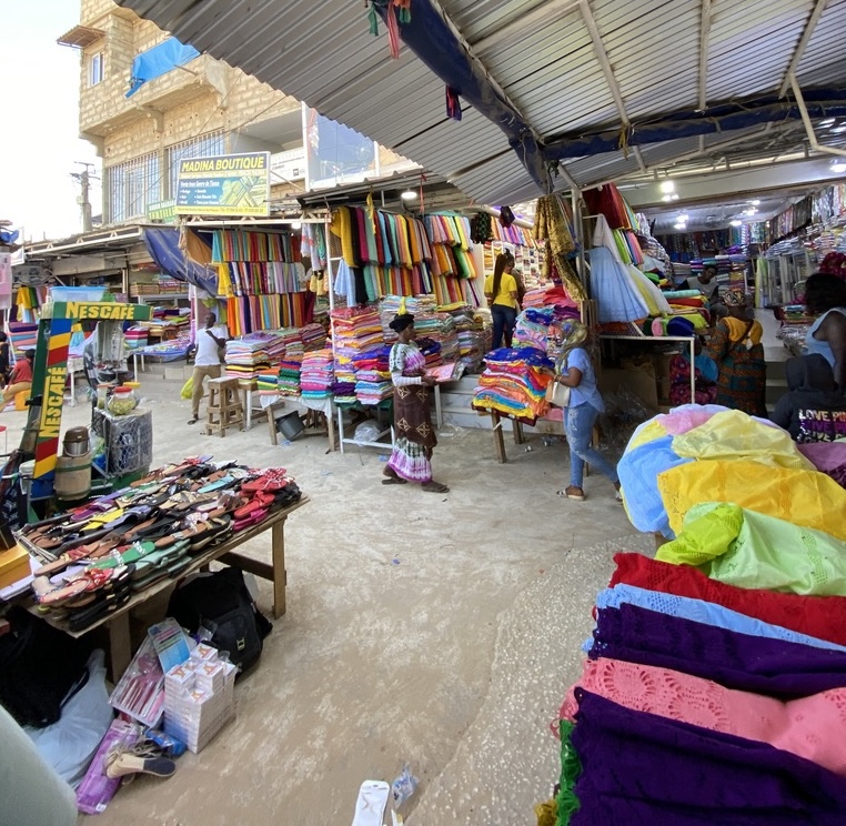 Wide angle shot of fabric market stall.